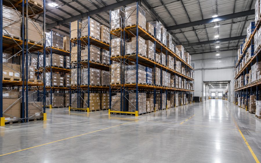 Warehouse aisle and concrete floor kept clean on a recurring schedule